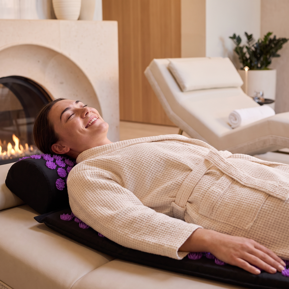 Woman using ZenPoint Acupressure Mat